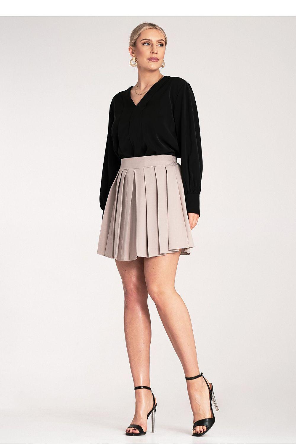 Beige pleated short skirt with waistband, structured pleats, and flared hem