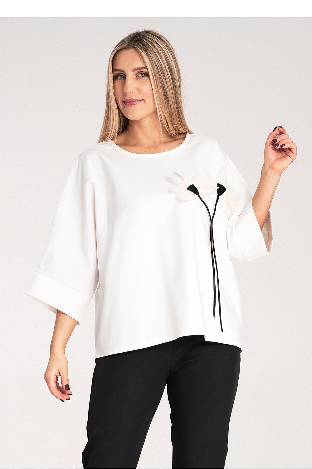 White kimono blouse with loose fit and black floral tie detail at chest