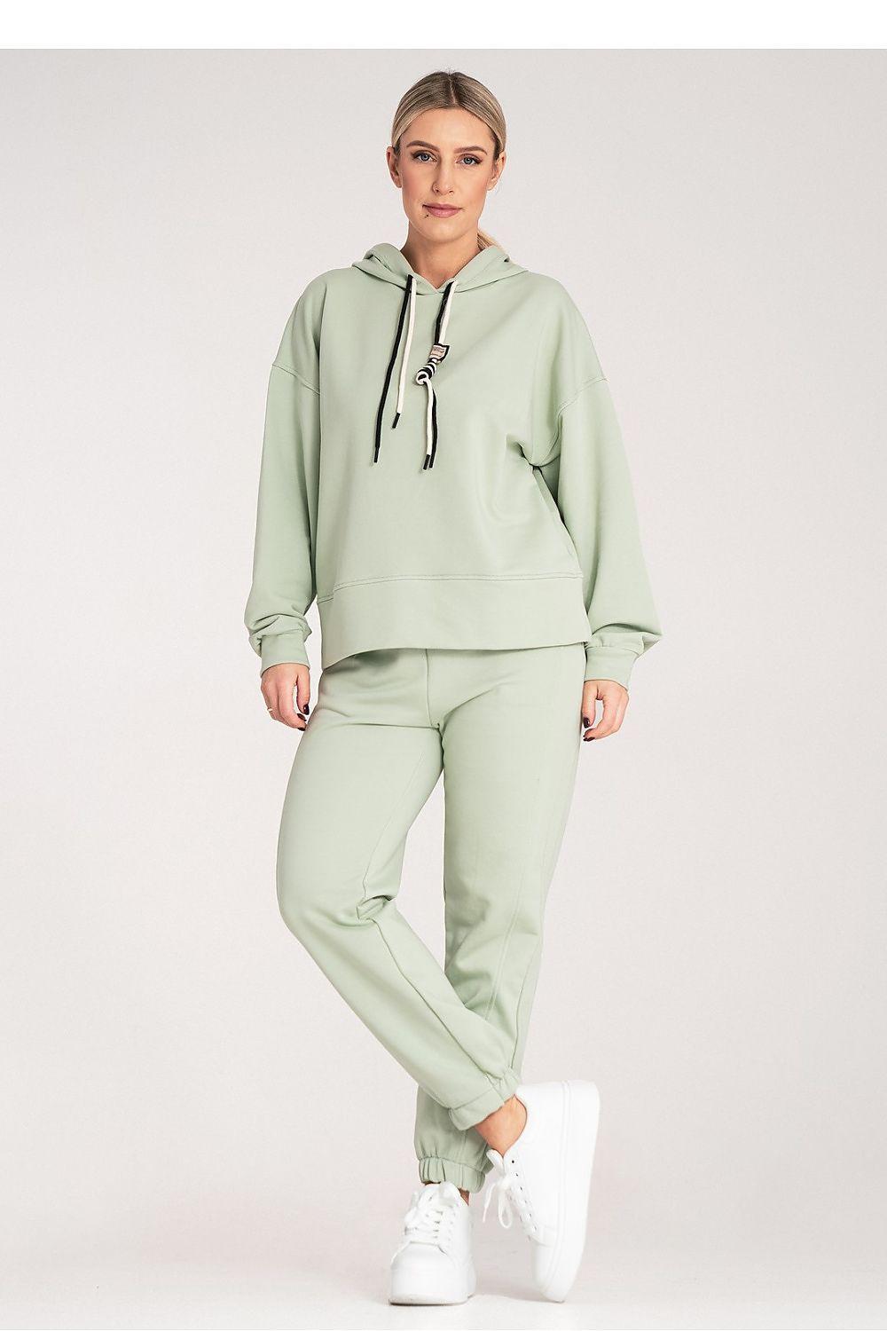 Women's green hoodie and jogger set with kangaroo pocket and cuffed joggers