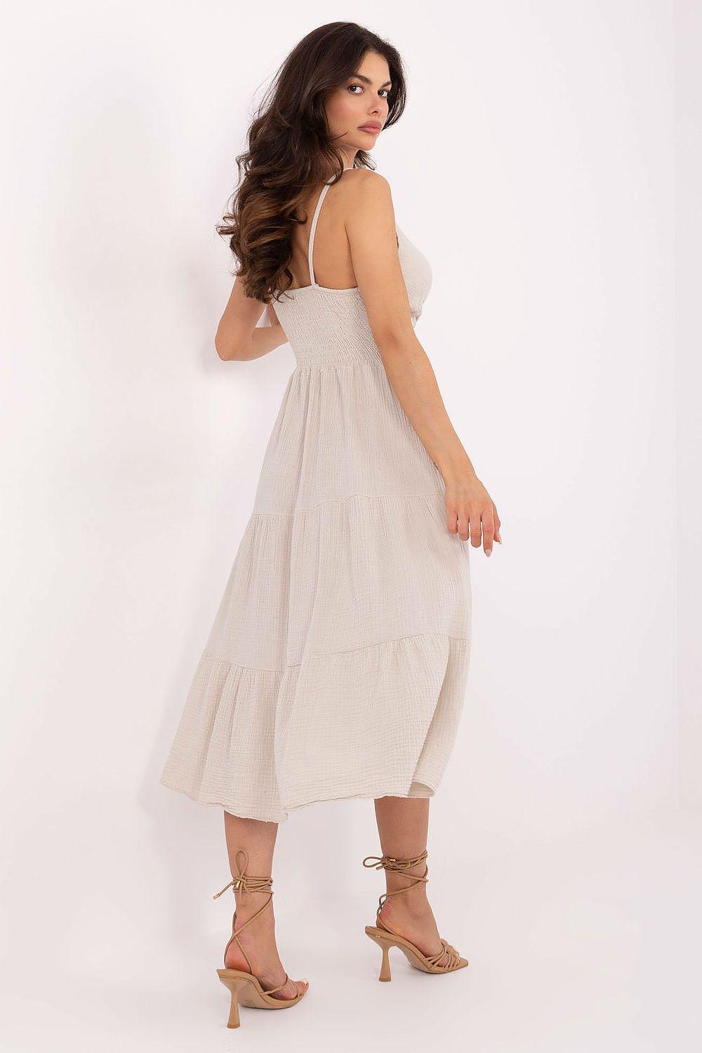 Beige sleeveless daydress, V-neck with spaghetti straps, tiered midi skirt, side view