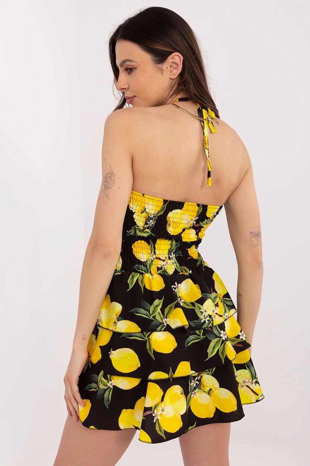 Black lemon-print daydress with spaghetti straps and tiered ruffle skirt