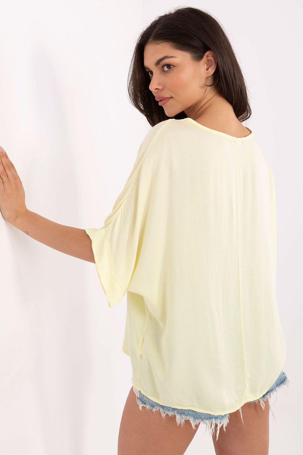 Yellow viscose V-neck blouse, back view with 3/4 sleeves and draped fit