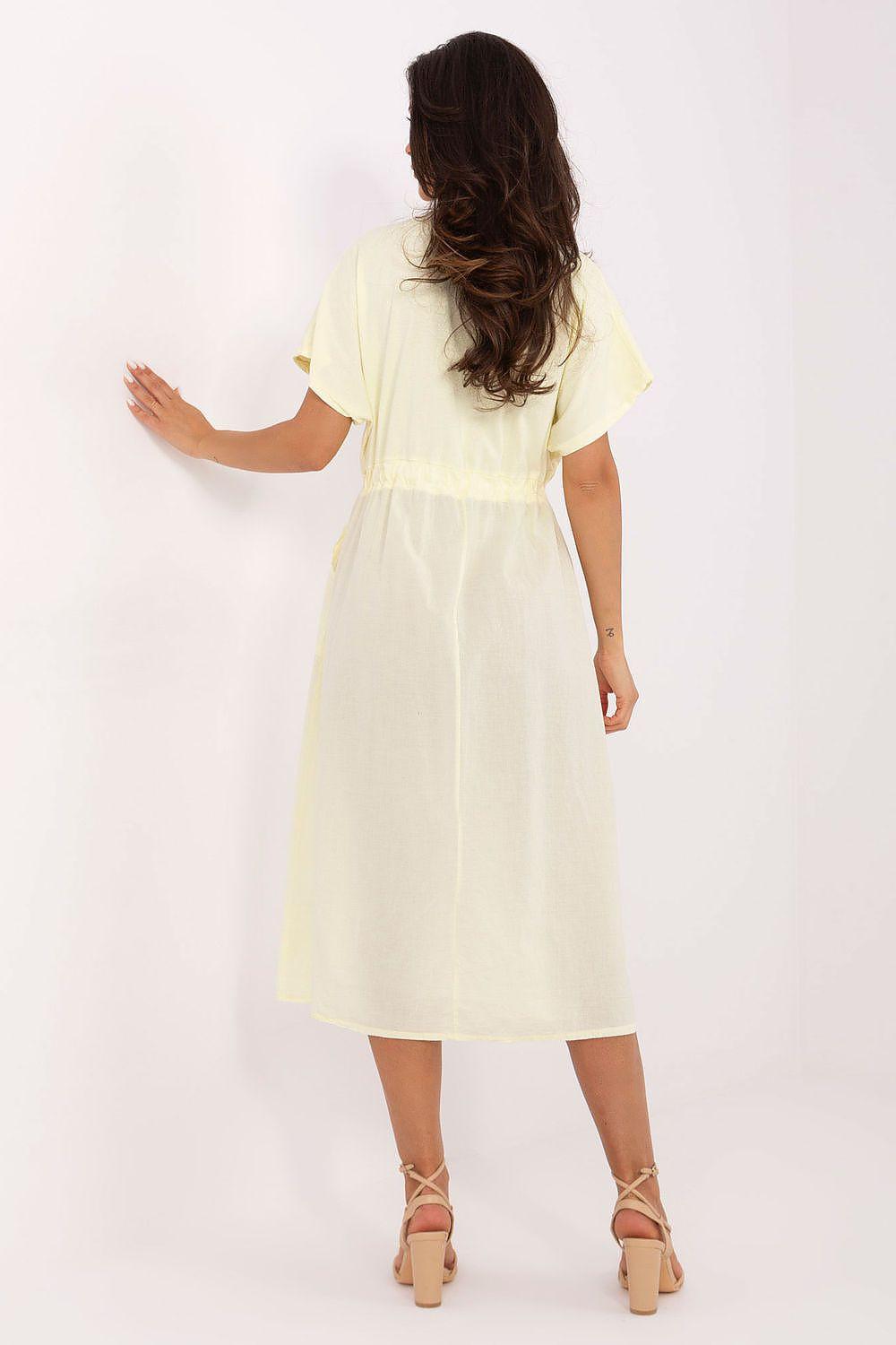 Yellow daydress back view with short sleeves and drawstring waist