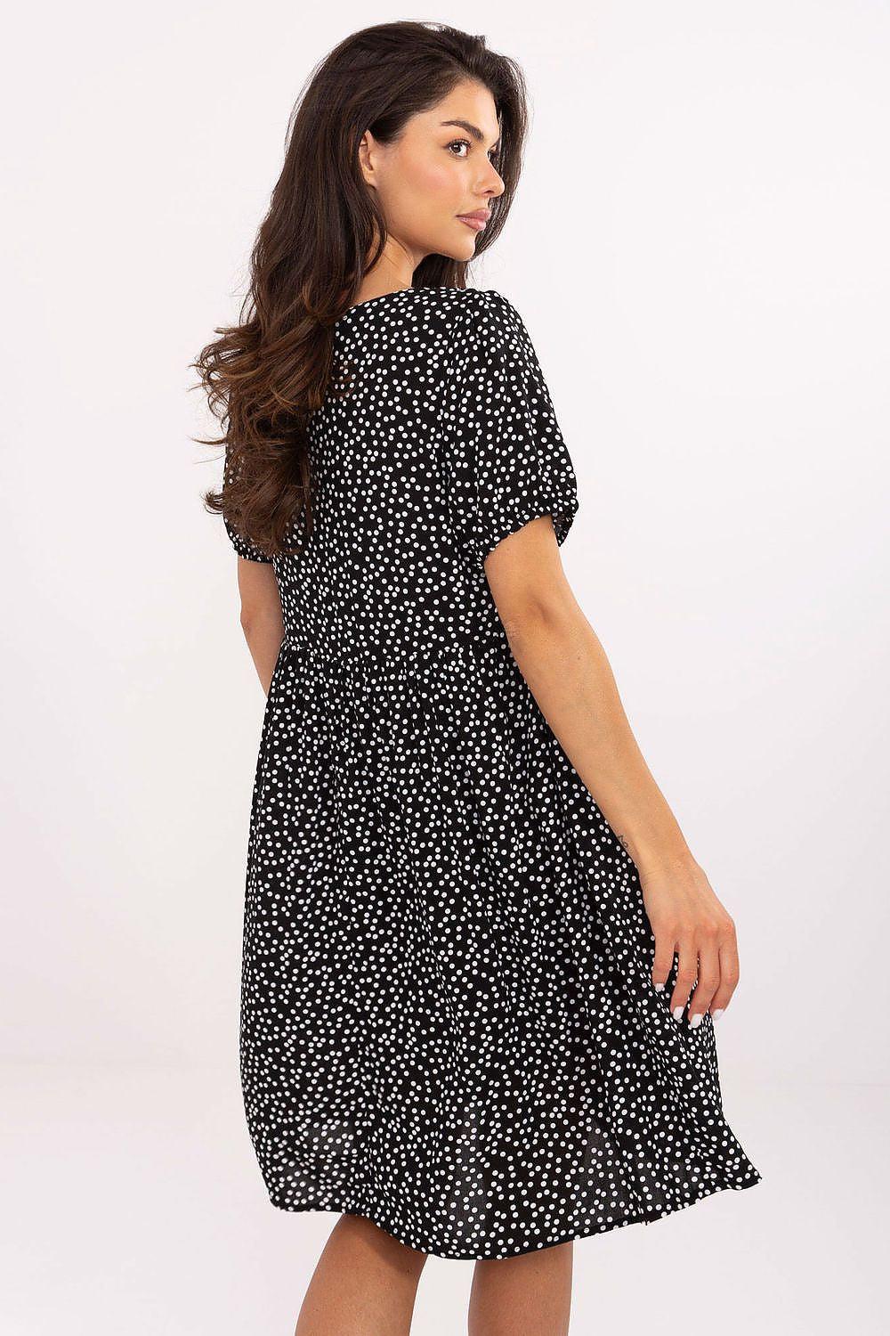 Black dot printed daydress with short sleeves and scoop neckline, gathered skirt