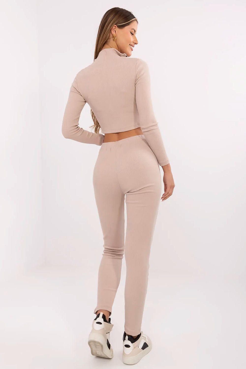 Beige zip-front cropped top and matching slim pants set, back view