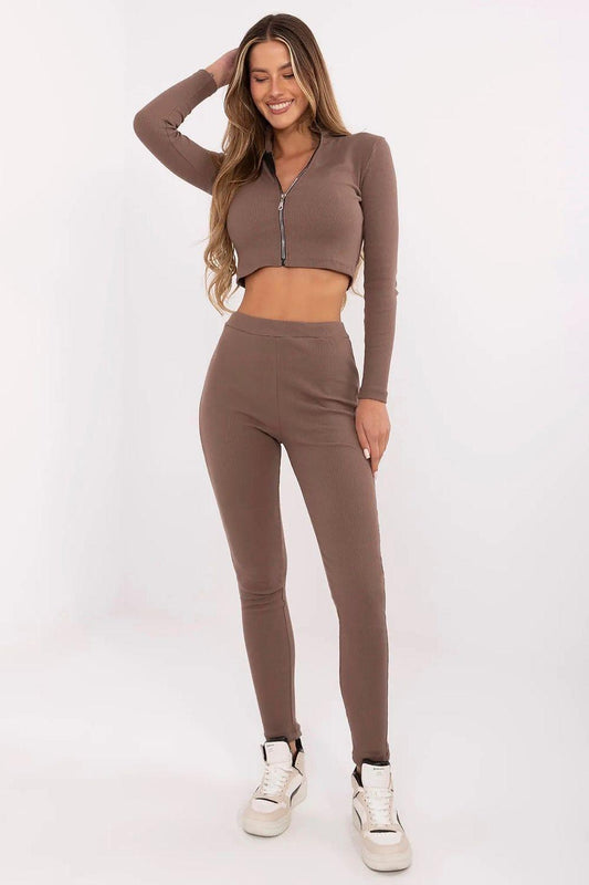Brown zip-front cropped top and matching slim pants with sneakers