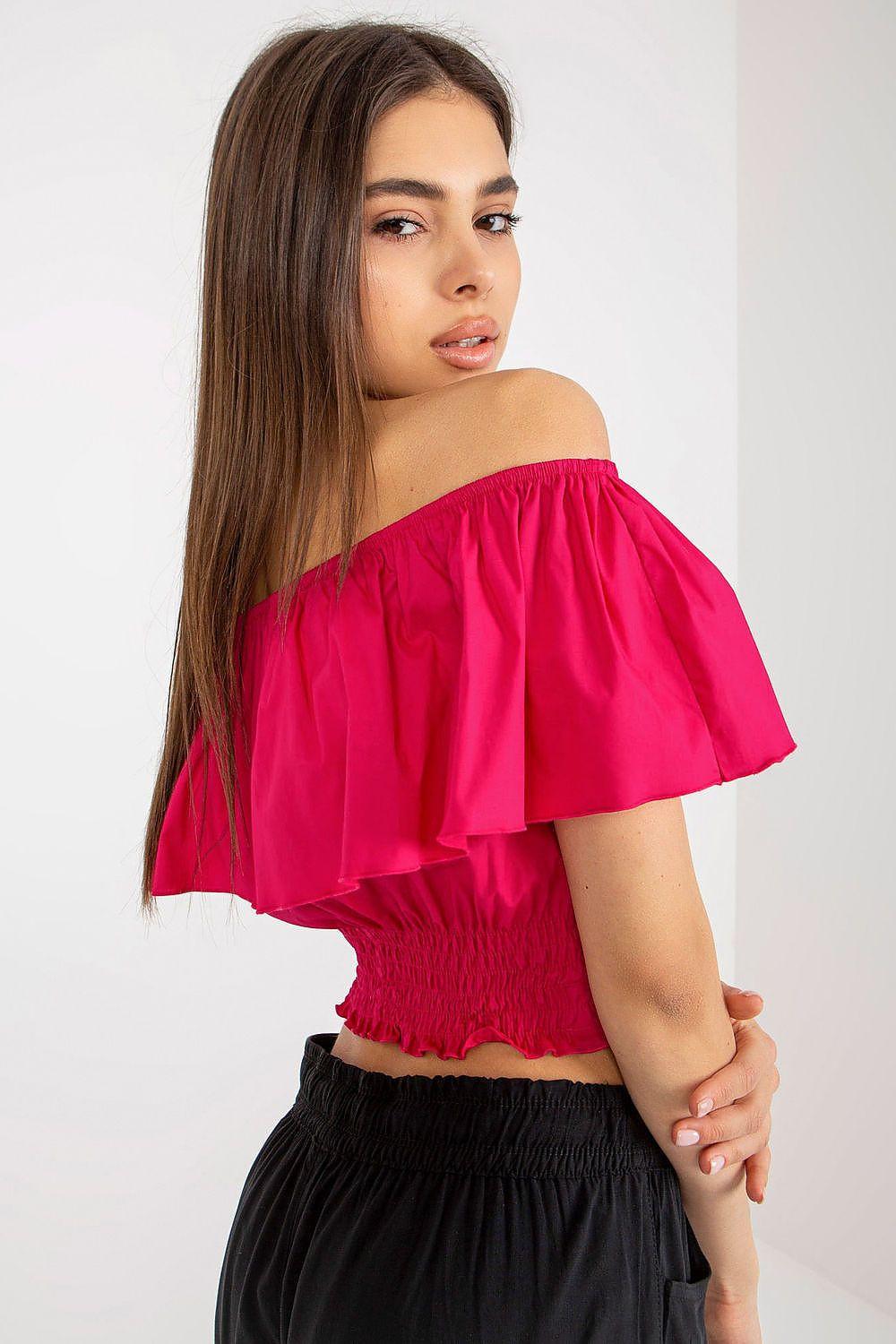 Pink off-shoulder blouse with wide ruffled sleeves and smocked texture