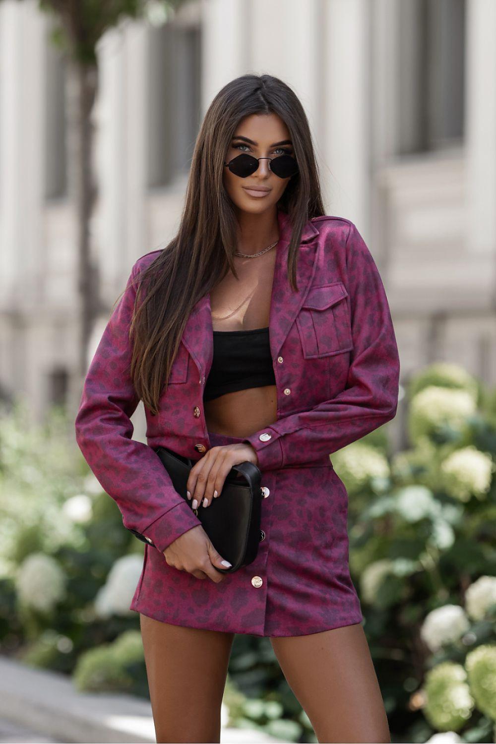 Magenta button-front long-sleeve short set with matching mini shorts, seated close-up
