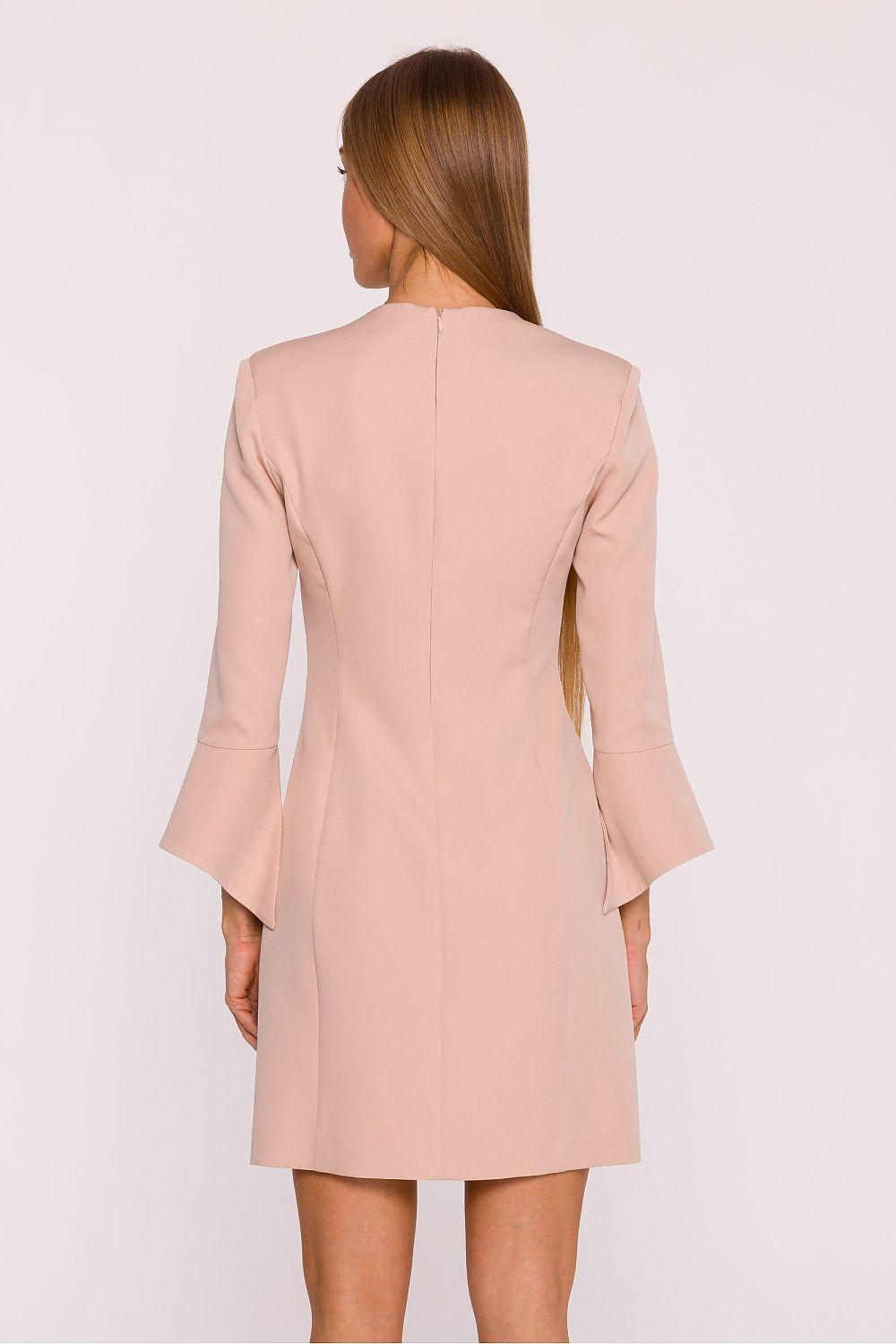 Beige daydress back view with center seam and flared bell sleeves