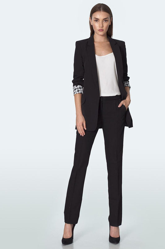 Black women’s blazer with patterned cuffs, open front and notch lapels, paired with pants