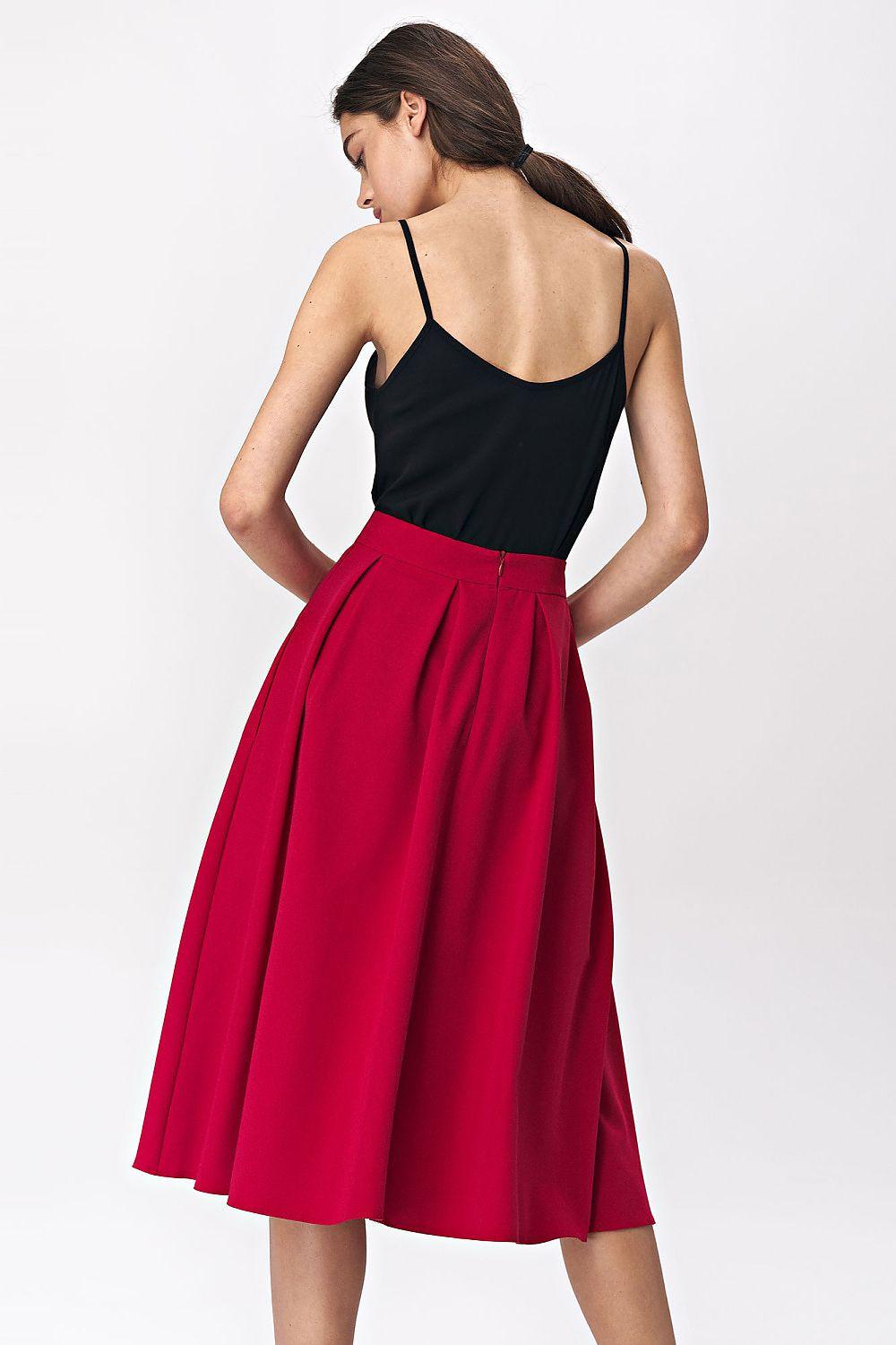 Red flared midi skirt viewed from back, gathered waist and pleated flare
