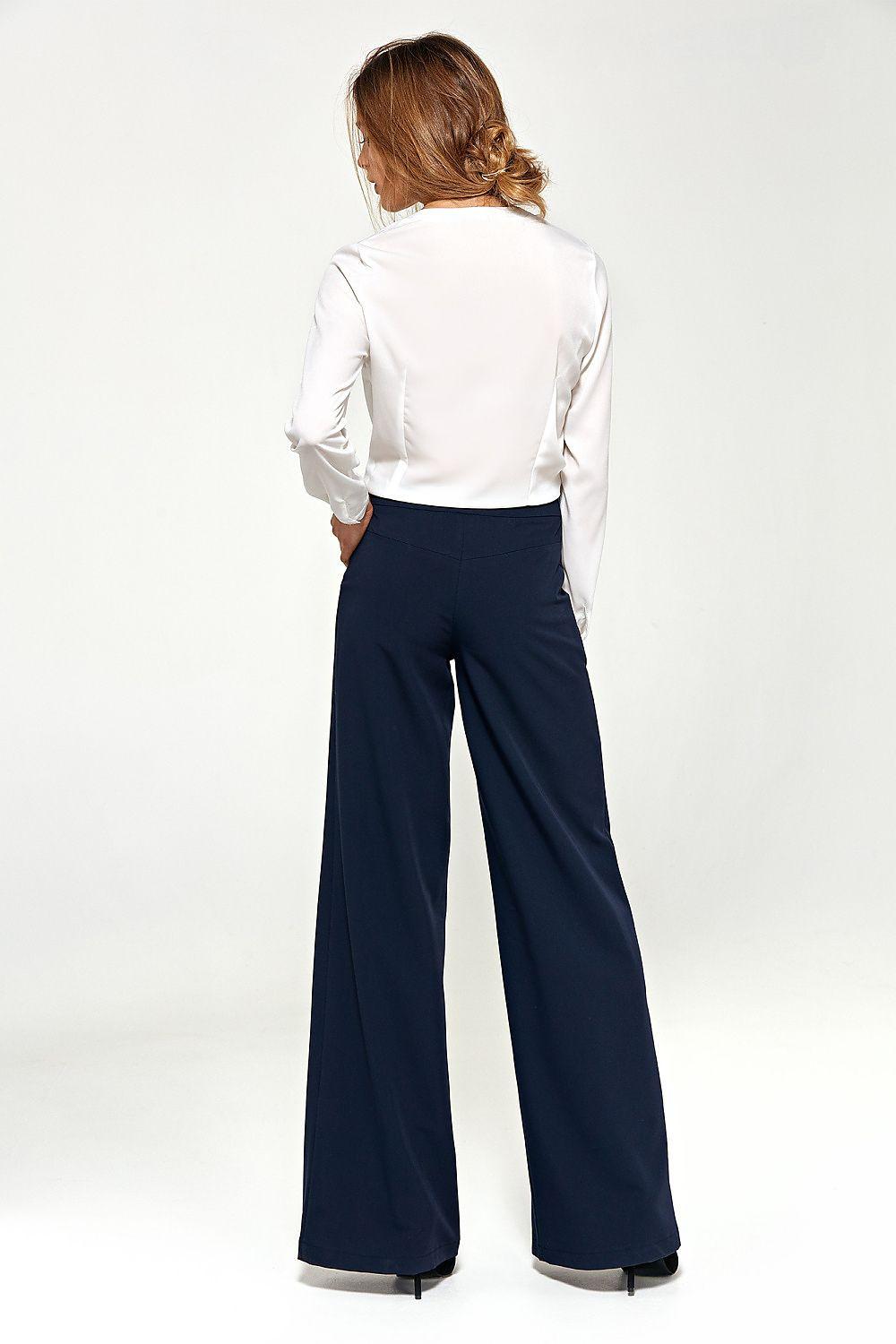 Nife navy blue wide-leg trousers viewed from back with full-length flare