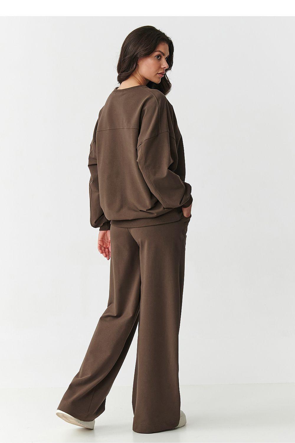 Brown lounge set with crewneck sweatshirt and wide-leg trousers, long sleeves.