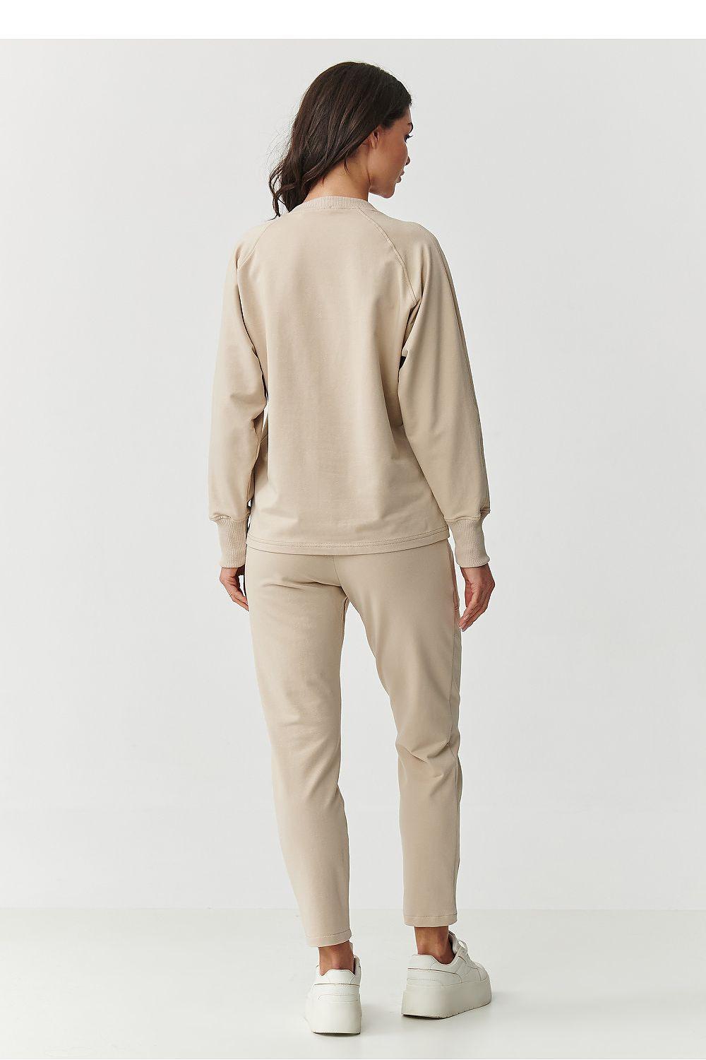 Beige sweatshirt and jogger pants set, back view with relaxed straight legs