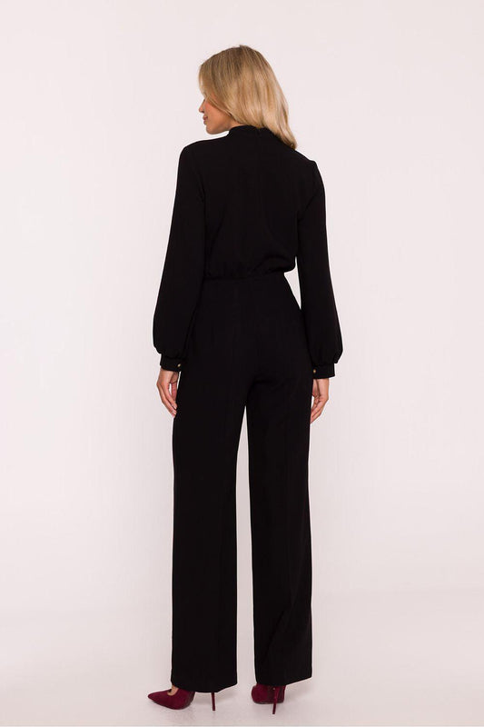 Black women's pantsuit from the back view with long sleeves and wide legs