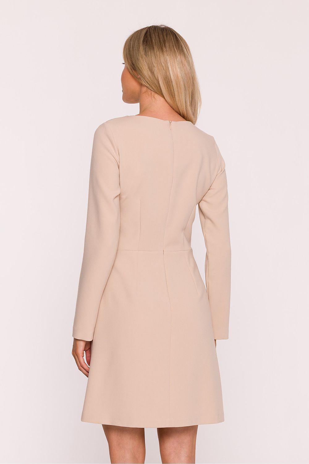 Beige daydress, back view with long sleeves and fitted waist seam, A-line skirt