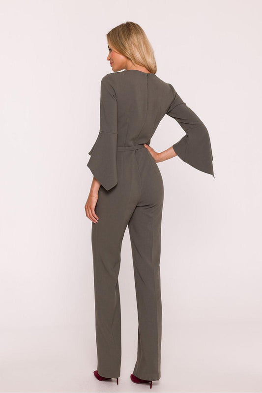 Women's dark gray jumpsuit from back view with belt at waist and wide bell sleeves