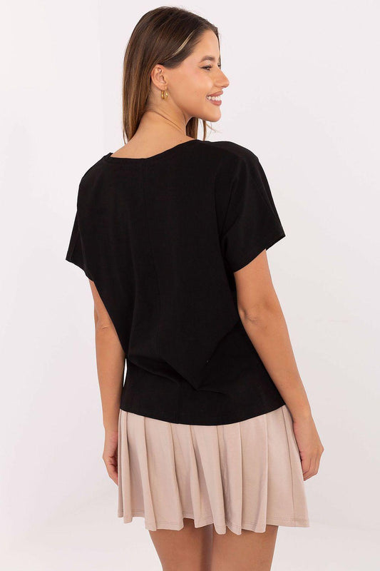 Black T-shirt and beige pleated mini skirt, two-piece outfit