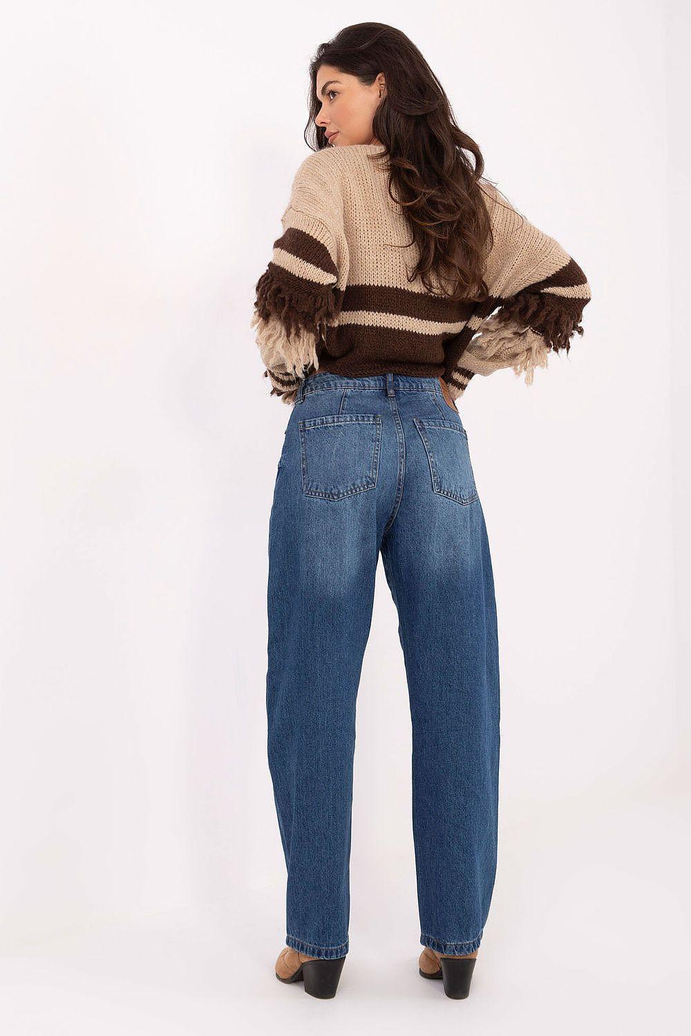 Blue denim jeans with high waist, side view, tapered straight legs.