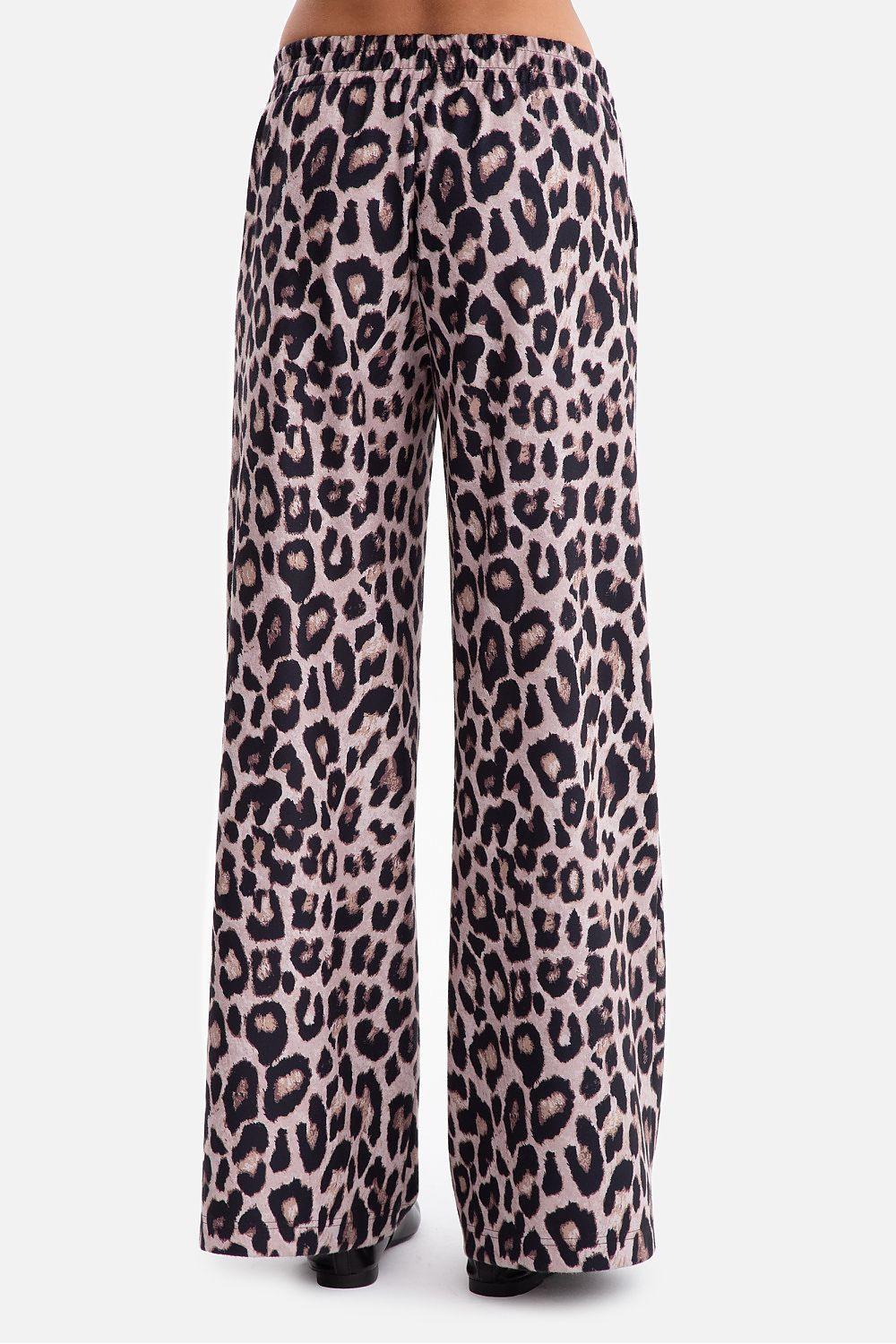 Women’s wide-leg trousers with leopard print in beige and dark purple.