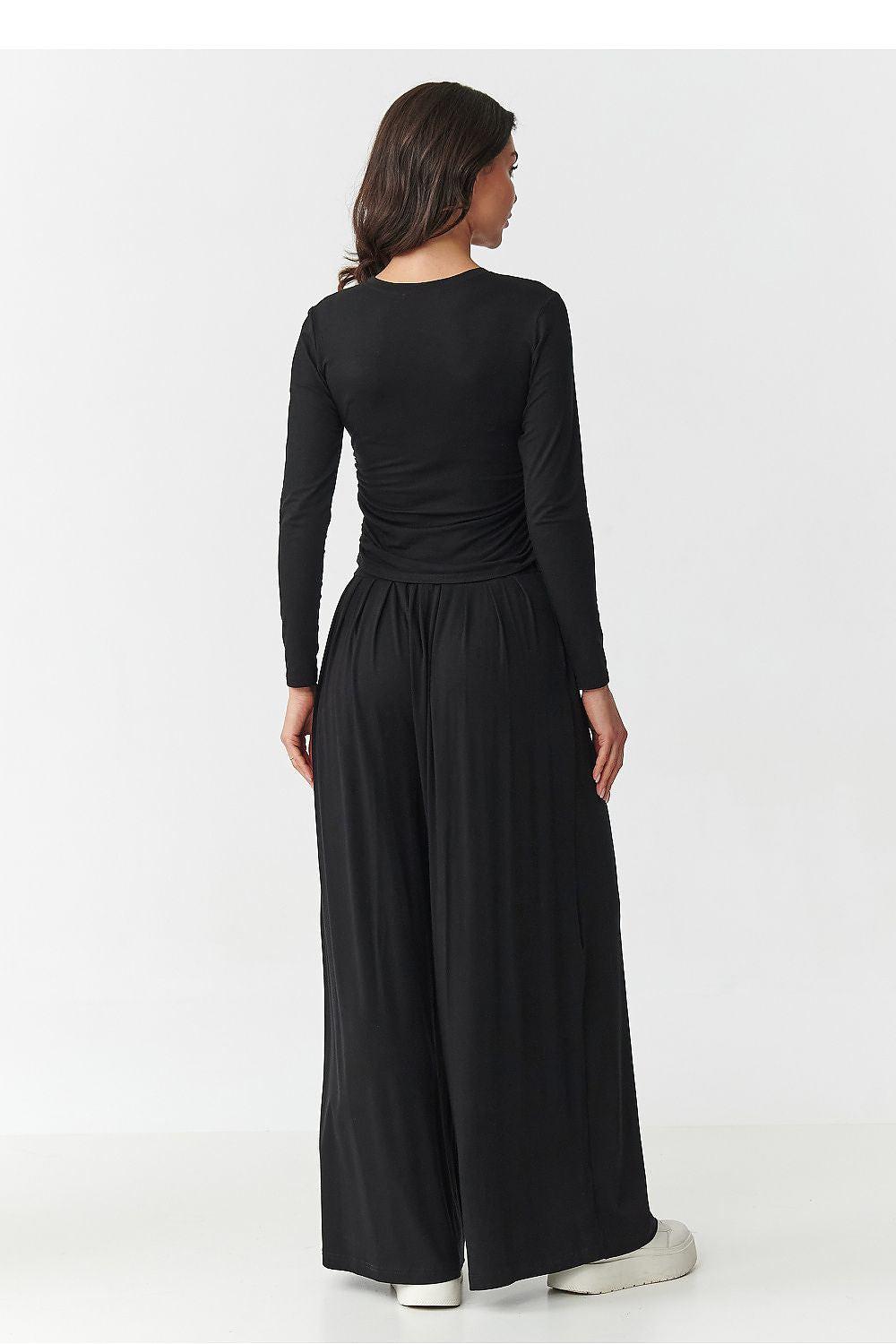 Women's black long-sleeve top and wide-leg palazzo pants set, back view.