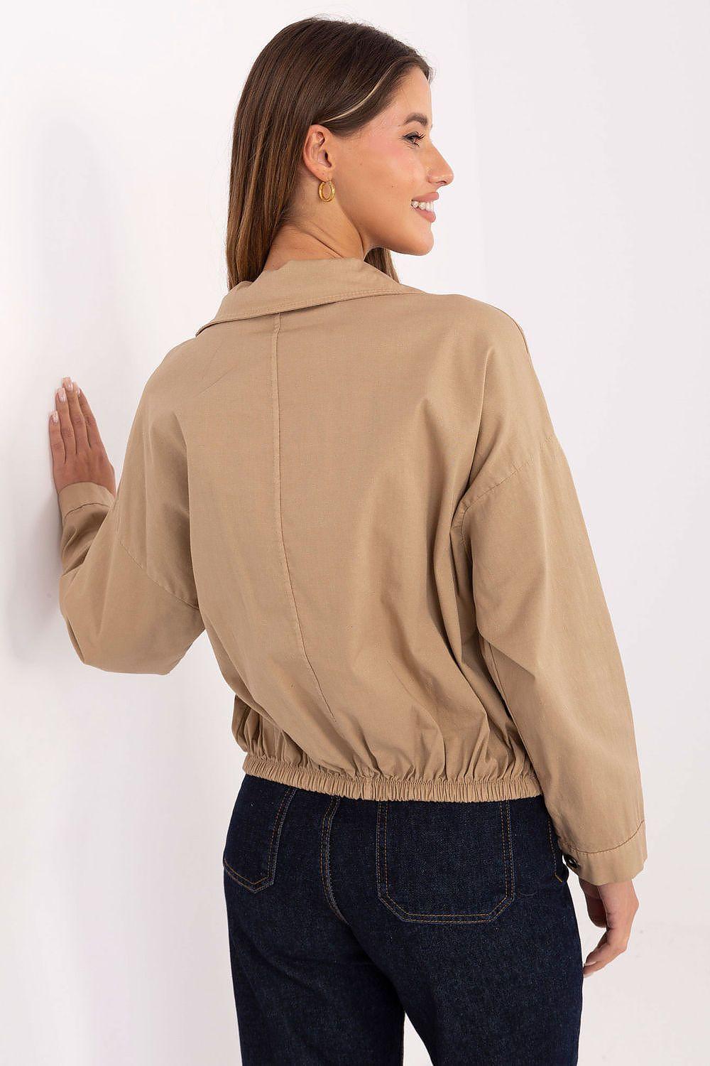 Long sleeve shirt in tan with back yoke seam and elastic waist hem