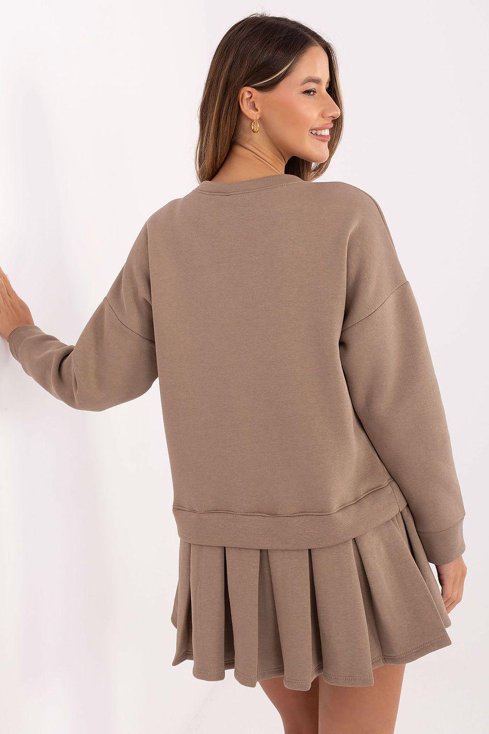 Beige daydress with long sleeve back view and pleated tiered hem