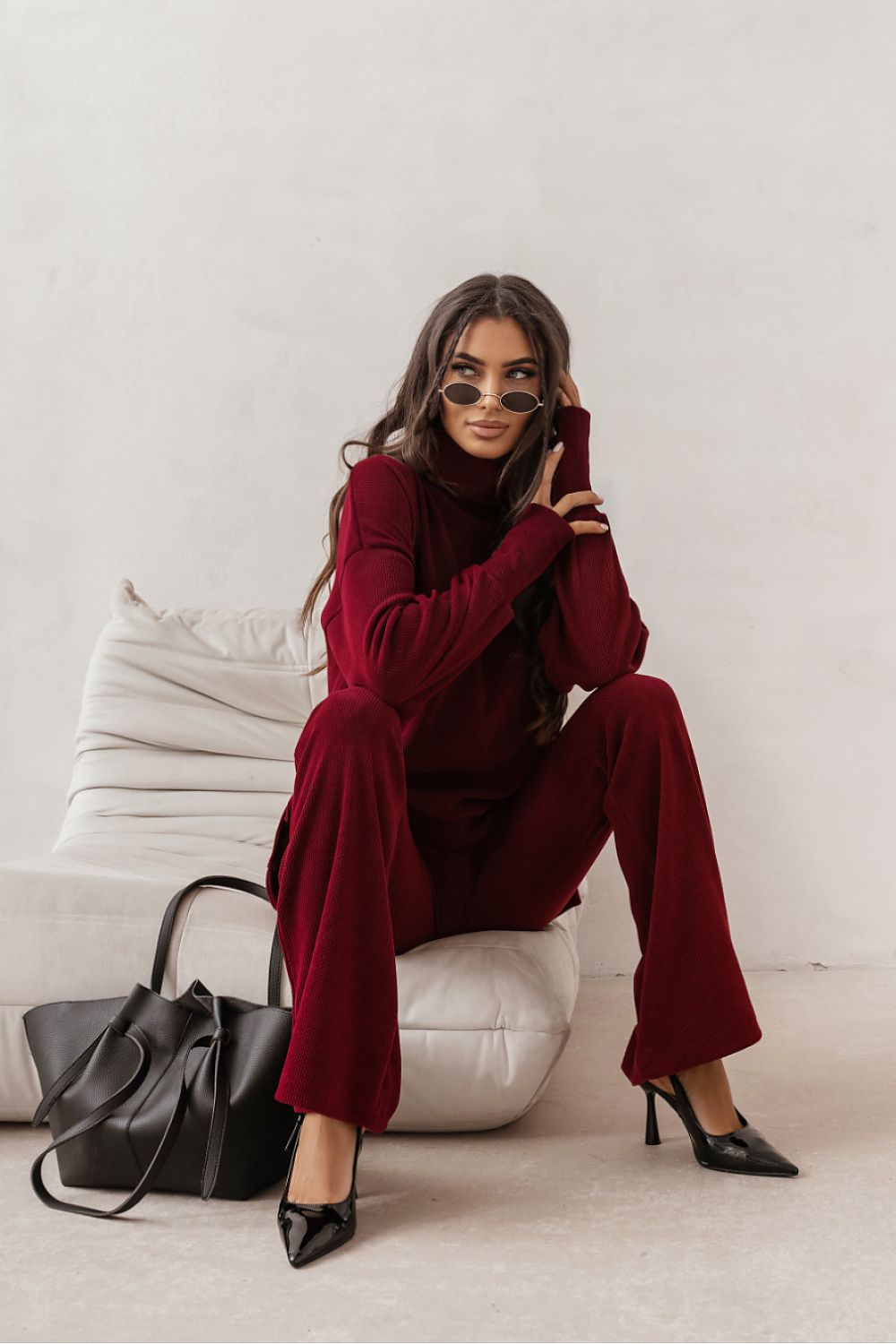 Burgundy flared trousers with relaxed fit and wide legs