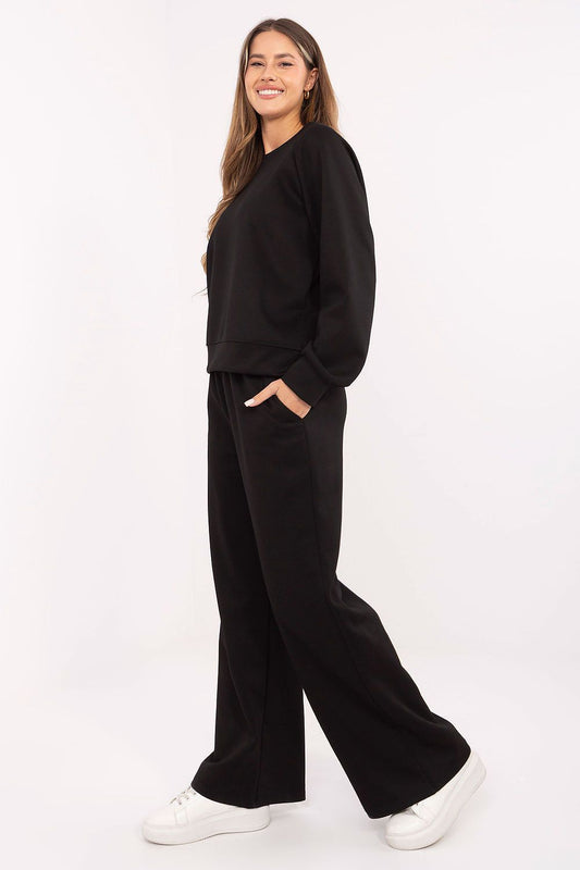 Black knit lounge set with crewneck sweatshirt and wide-leg pants, three-quarter view