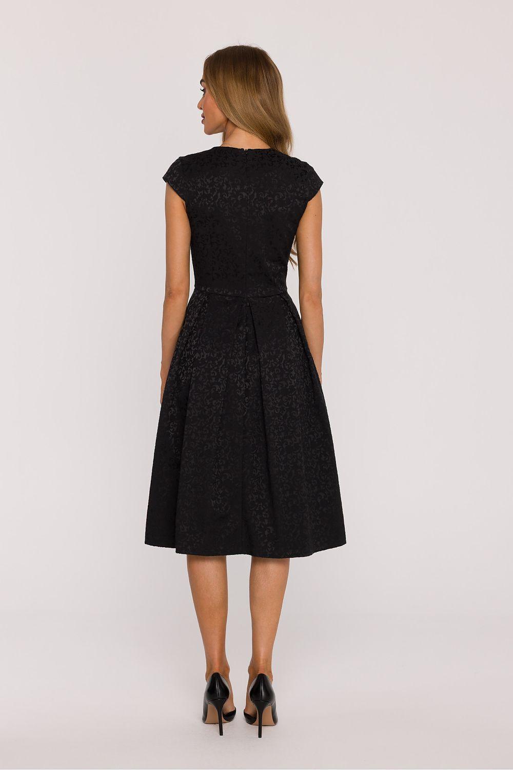 Black evening dress, back view, short sleeves, fitted waist, flared midi skirt