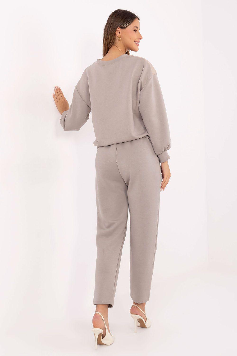 Beige quilted blouse and tapered pants set viewed from back, long sleeves