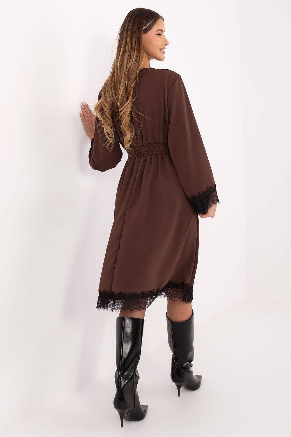 Back view of brown midi cocktail dress with long sleeves and lace-trim hem.