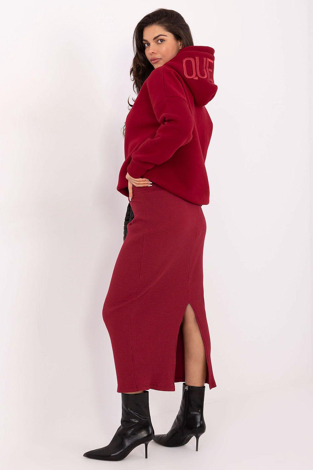 Ribbed red knit midi skirt with high waist and visible front slit