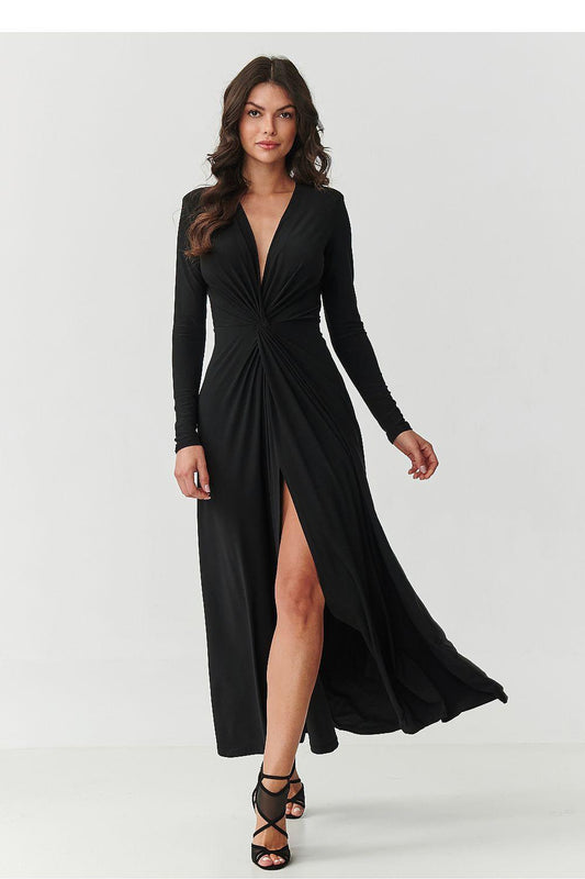 Black maxi dress with V-neck, long sleeves, ruched front and leg slit