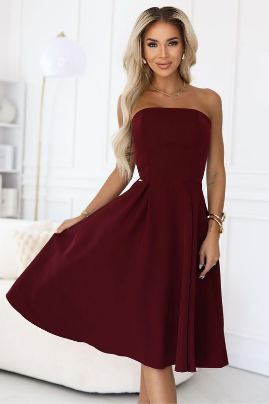 Burgundy strapless evening dress with sweetheart neckline and pleated flared skirt