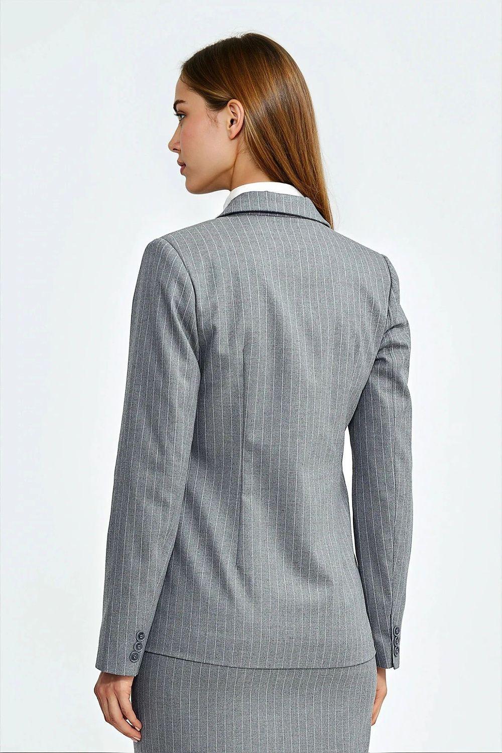 Grey fitted blazer back view with notched collar and long buttoned sleeves