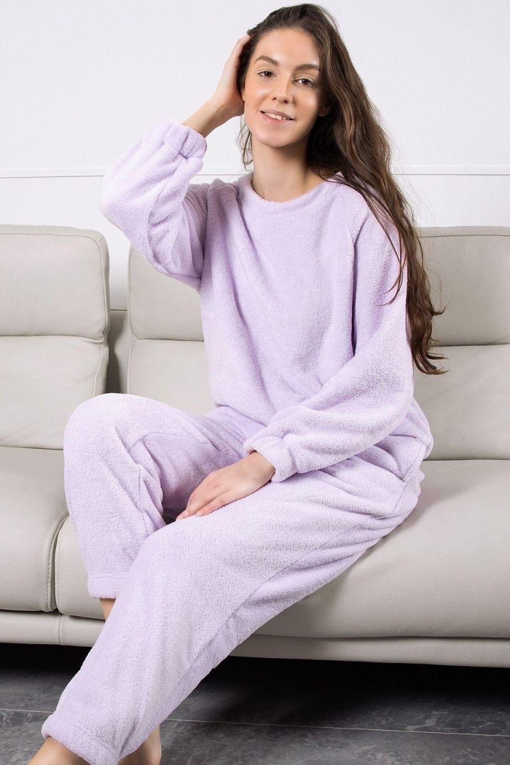 Violet lounge set with crewneck sweatshirt and jogger pants, relaxed seated
