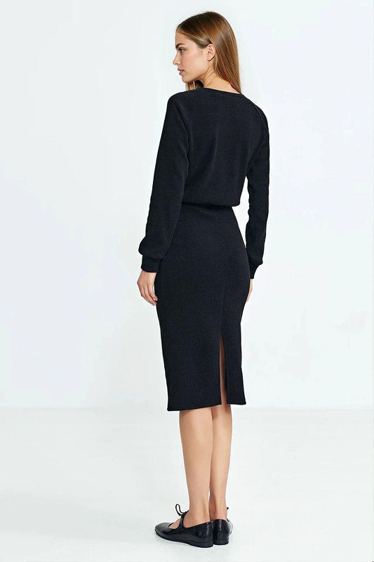 Black ribbed midi daydress back view, long sleeves, elastic waist, slit hem