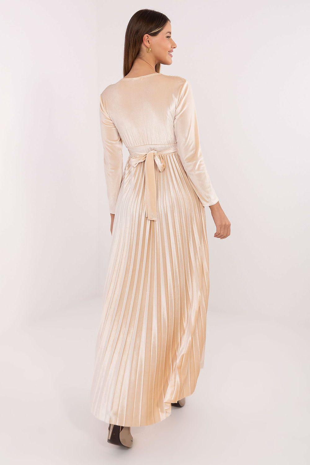 Long beige long-sleeve dress back view with gold sequin detail and pleated skirt