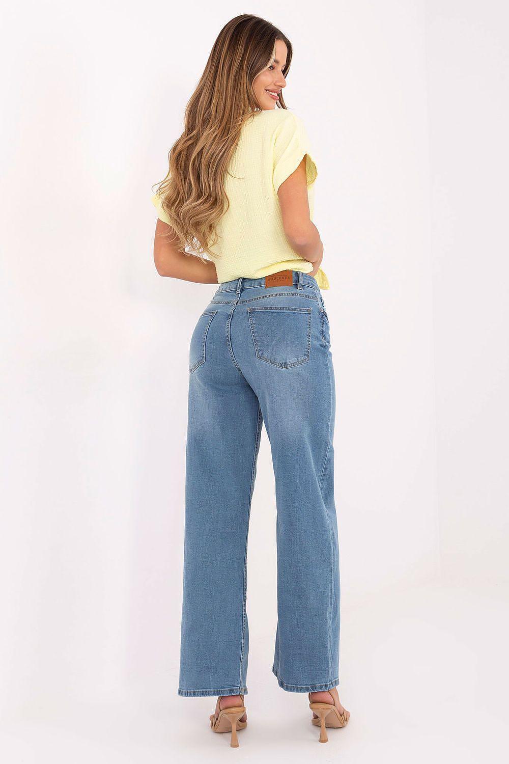 Light blue denim jeans with button fly, wide straight legs, and rear pockets