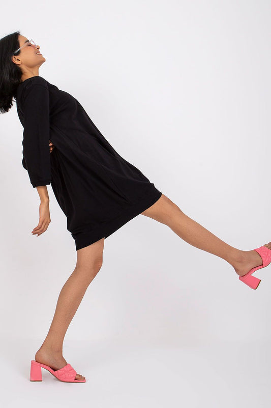 Black cotton sweatshirt day dress, loose fit, long sleeves, round neck side view