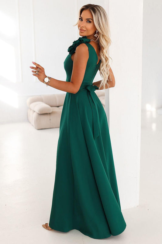 Green maxi evening dress with floral shoulder detail and gathered skirt