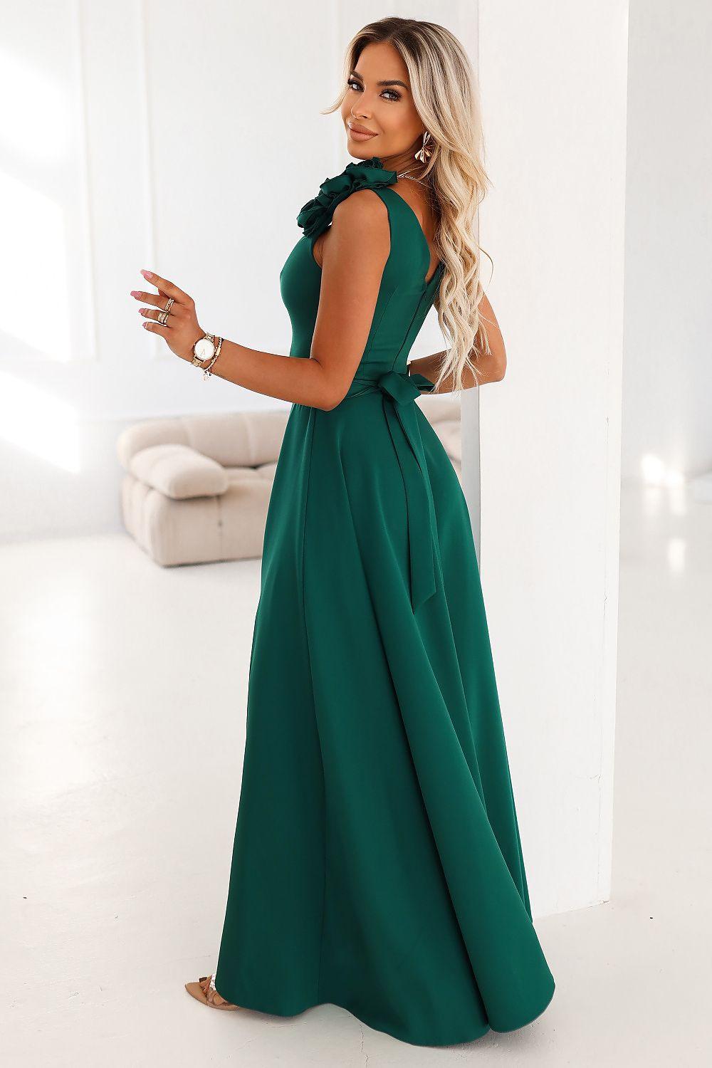 Green long sleeveless dress with ruffled shoulder, fitted bodice, full skirt