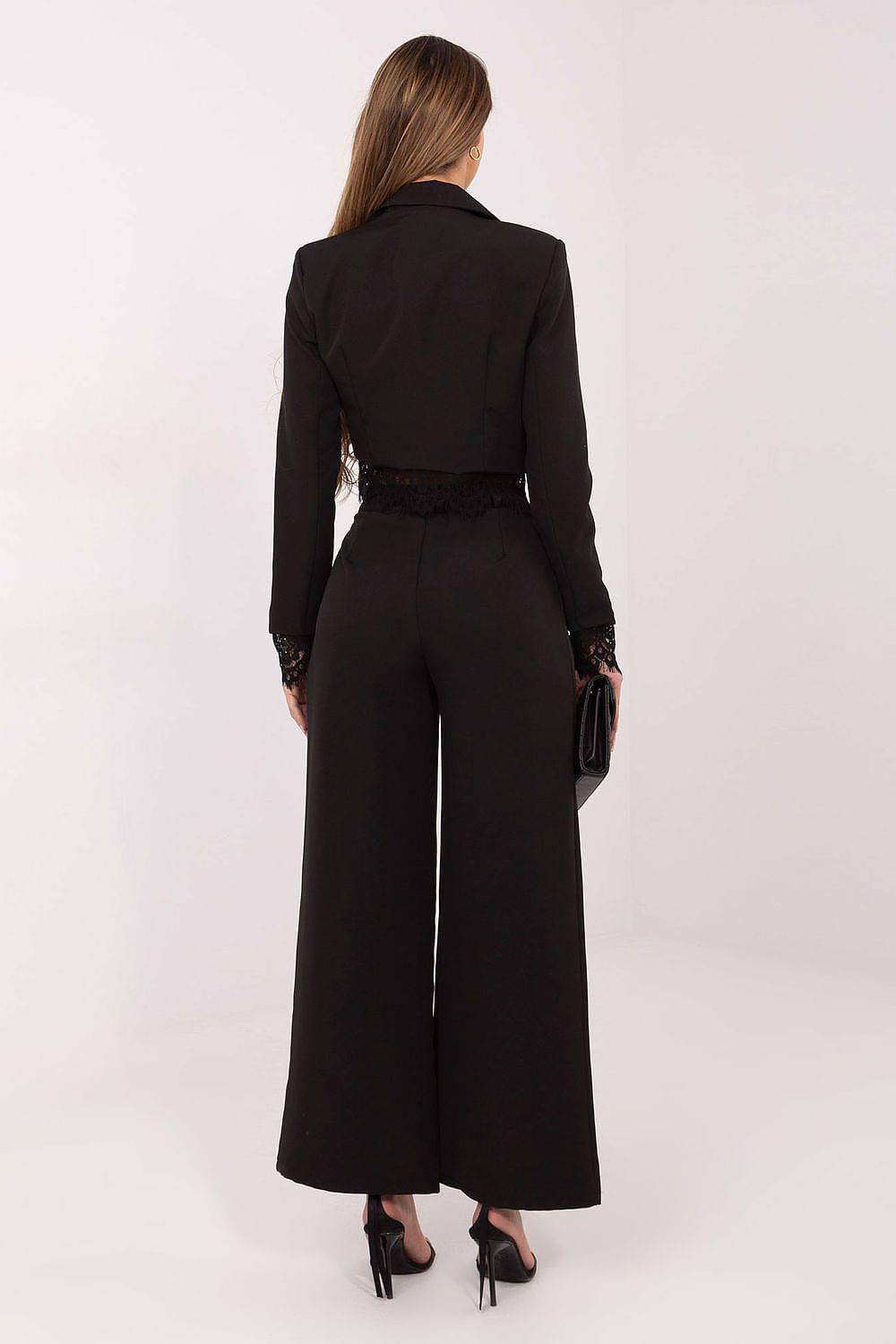Black high-waisted wide-leg trousers shown from the back with ankle-length legs