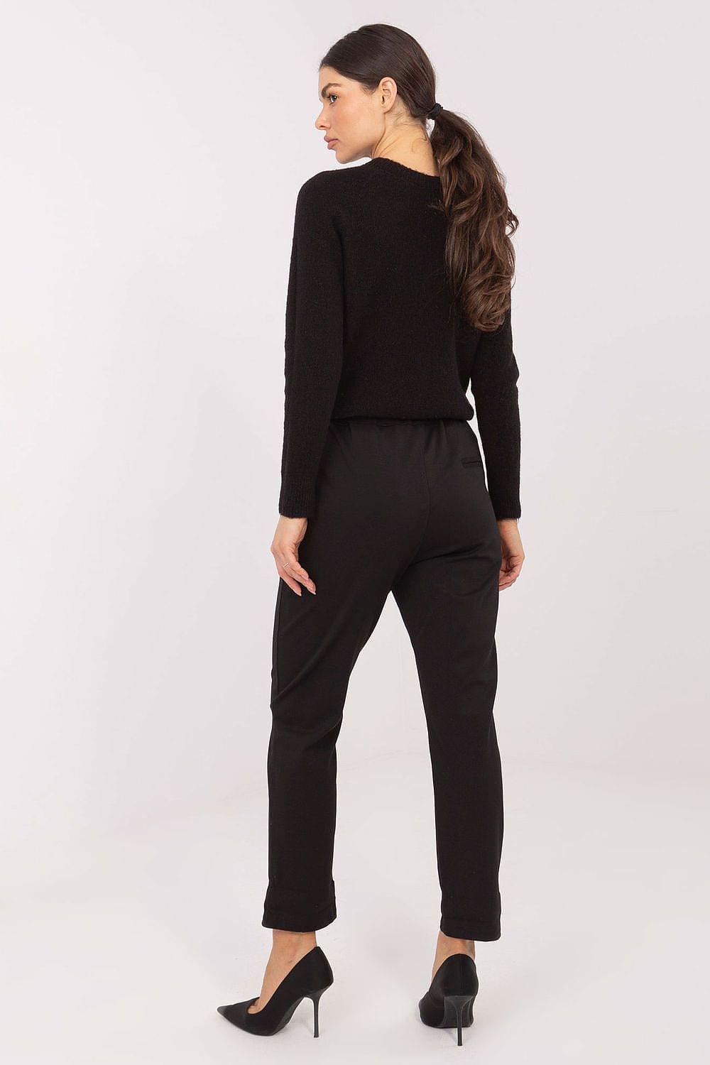 Black women’s trousers, back view, drawstring waist and tapered legs