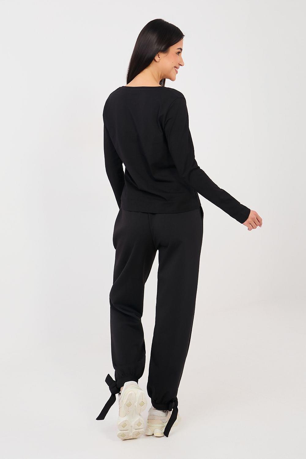 Tracksuit trousers, black, drawstring waist, back view, cuffed ankle legs