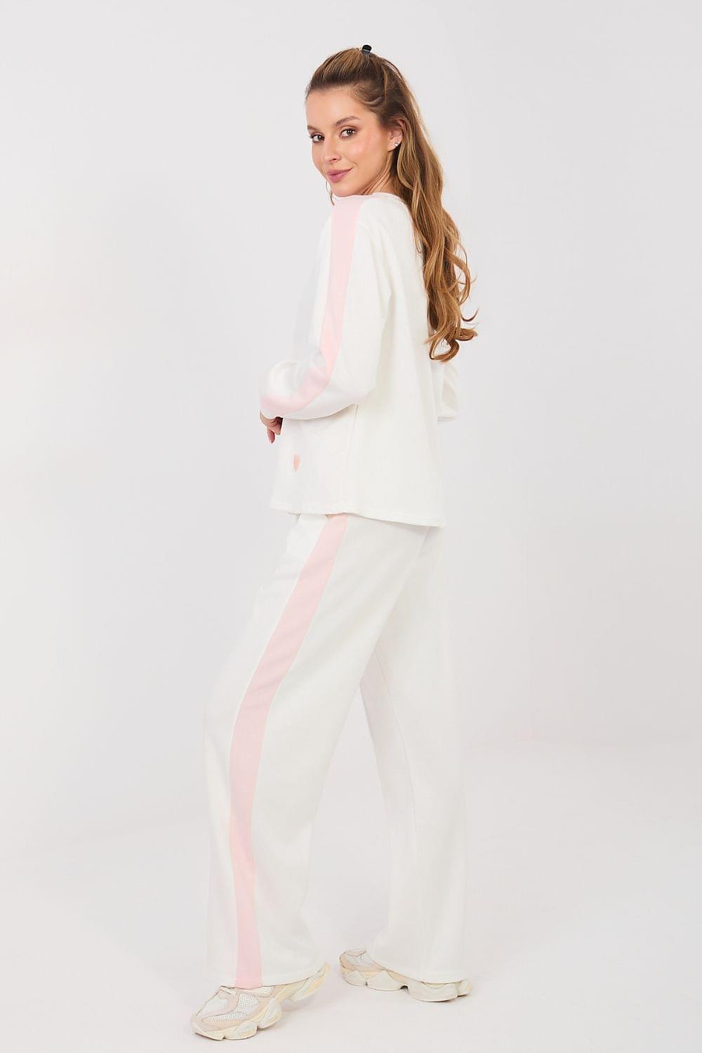 Two-piece lounge set, white long-sleeve top and wide-leg pants with light pink accents