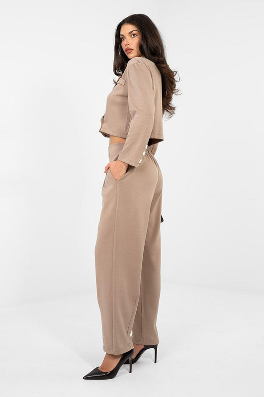 Beige two-piece pants set in side view: cropped jacket and high-rise straight trousers.