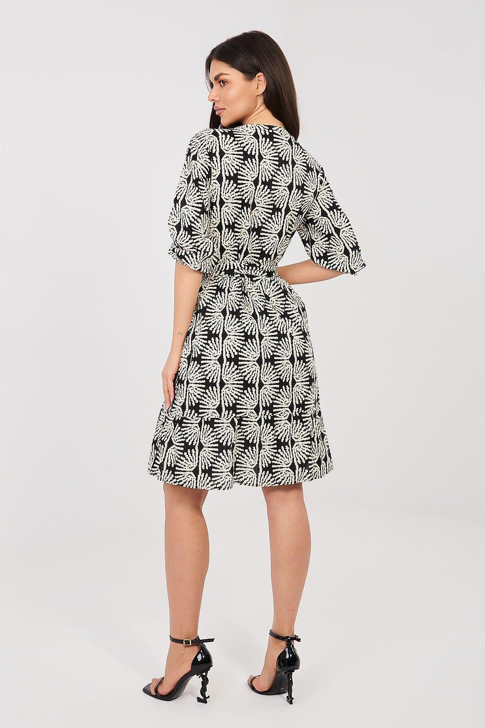 Black-and-white leaf-print day dress with 3/4 sleeves and flared skirt, back view