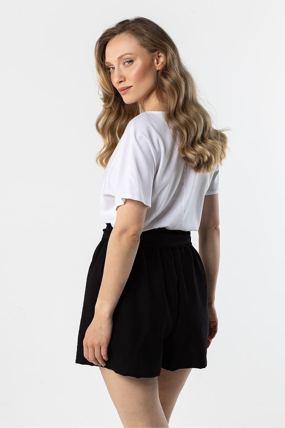 Women's black shorts with gathered elastic waistband and short length